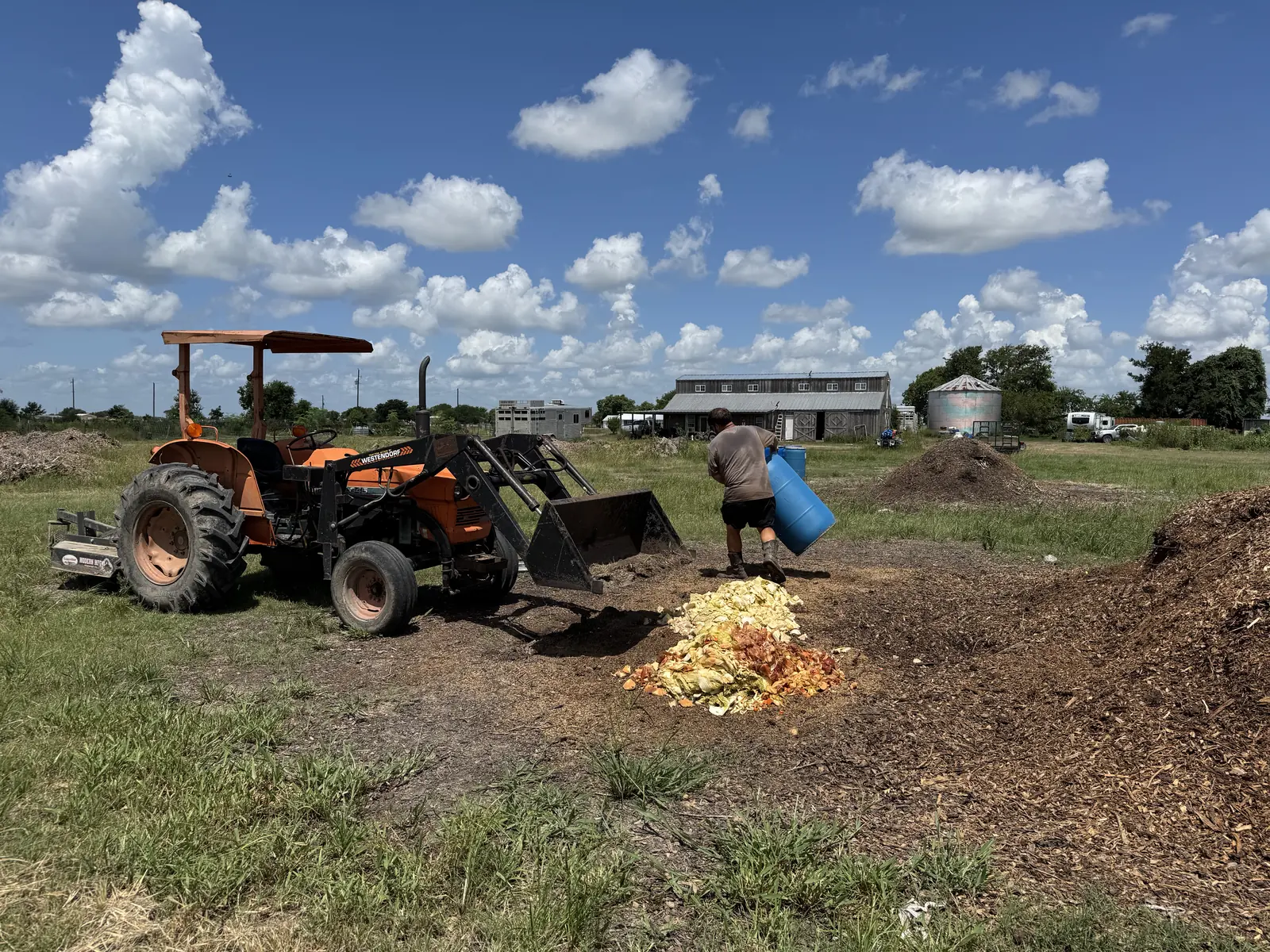 Fresh food scraps from Houston-area businesses layered onto wood chips to begin composting